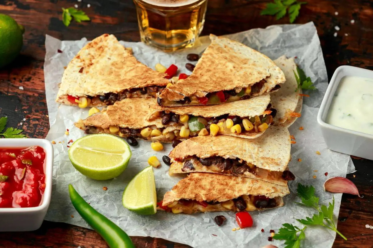 vegetarian mexican black beans tomato cheese and corn quesadilla
