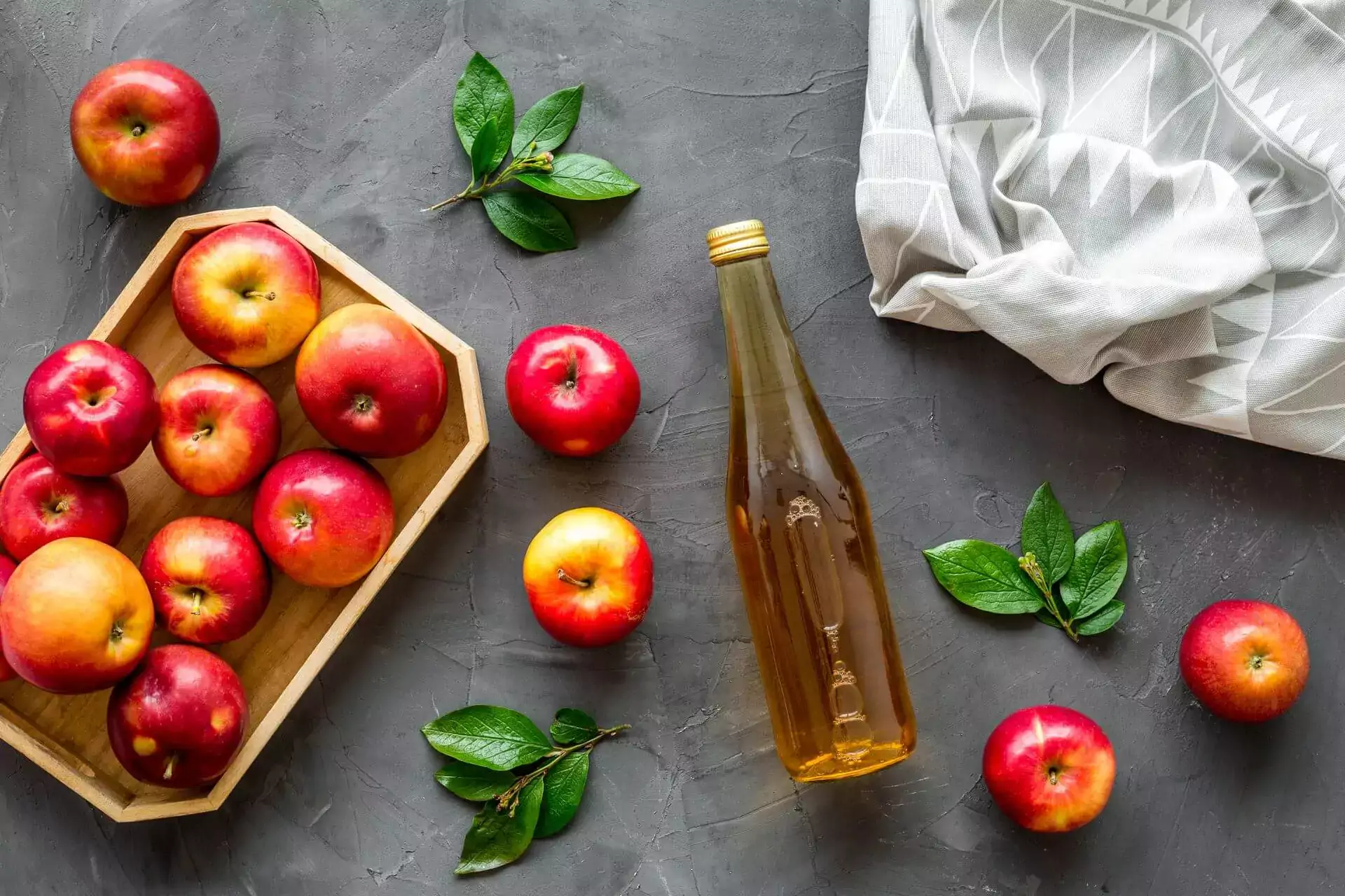 apple cider or vinegar. bottle with ripe fruits and leaves